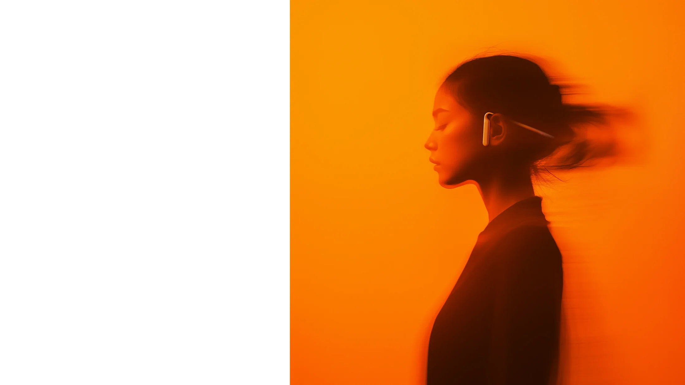 A person wearing the Wearable AI concept in warm orange light